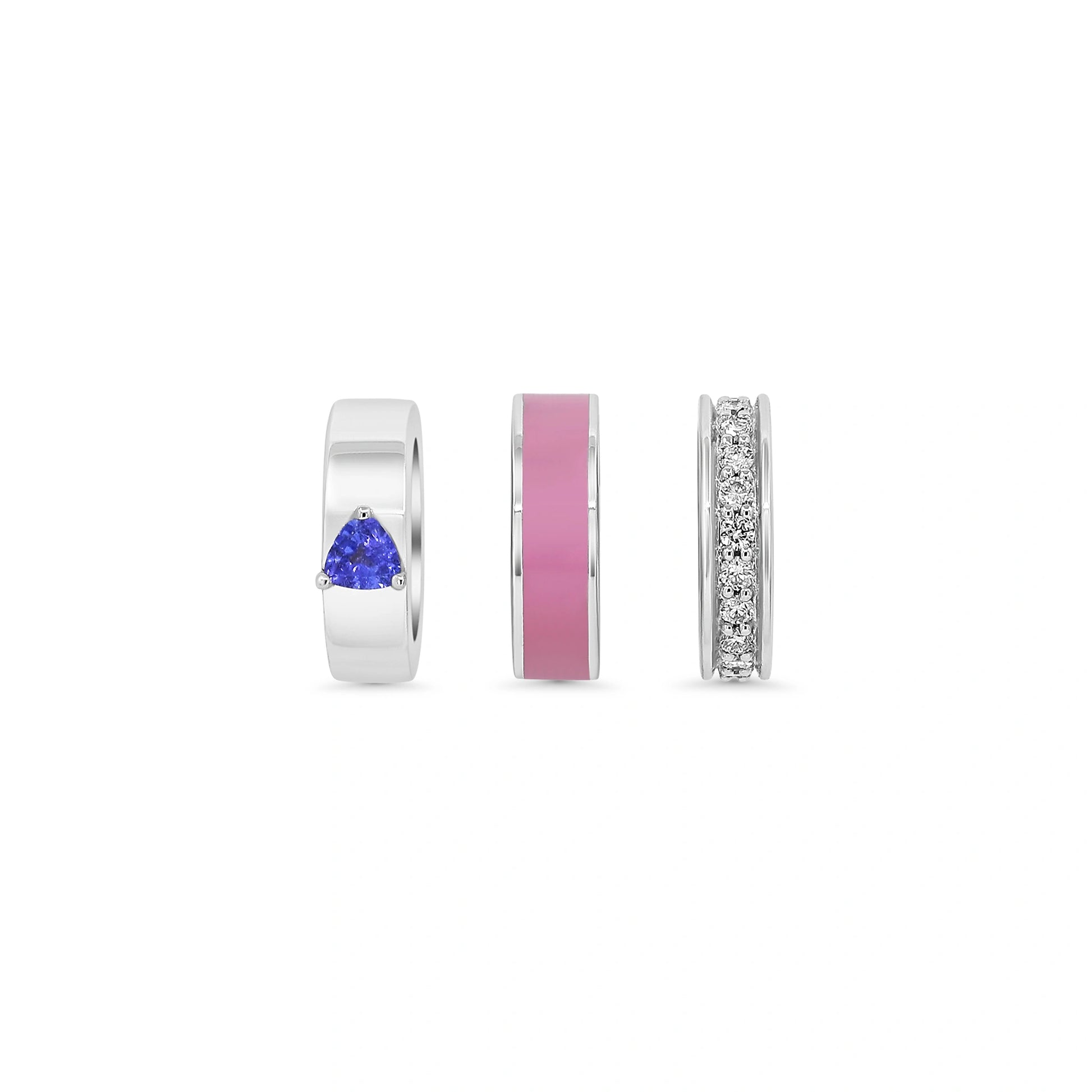 Three silver rings with gemstones on a white background