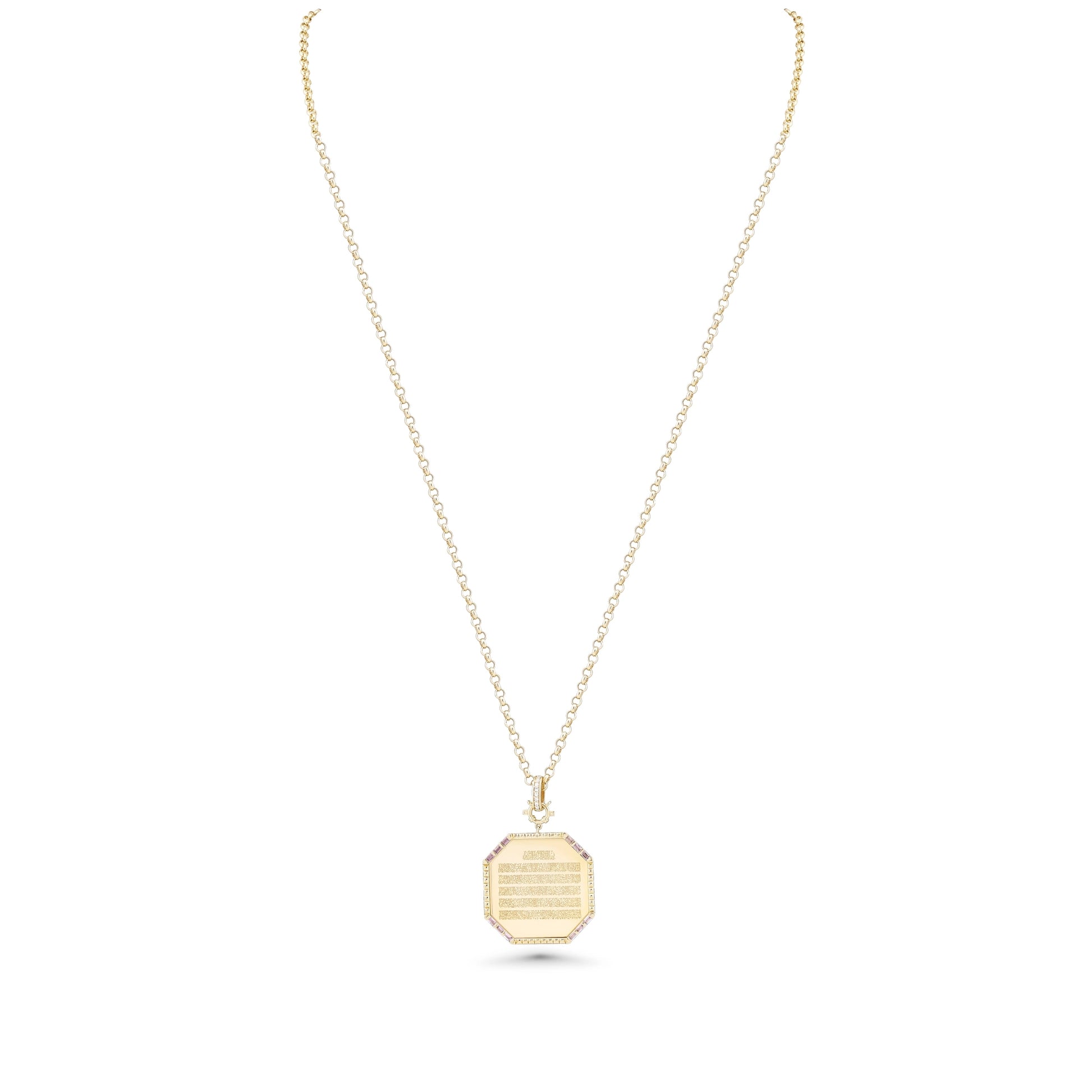 Gold necklace with a hexagonal pendant on a white background
