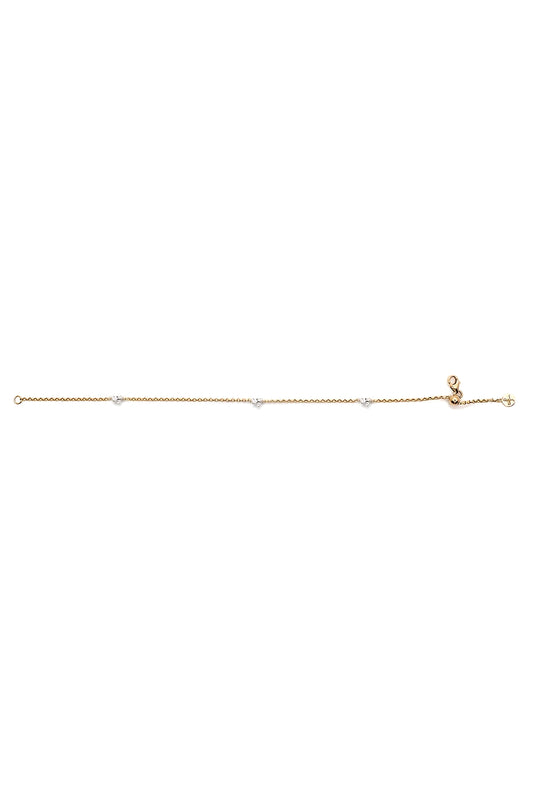 Gold anklet on a white background