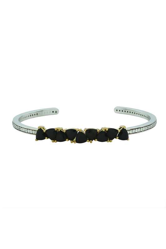 Silver bracelet with black stones on a white background