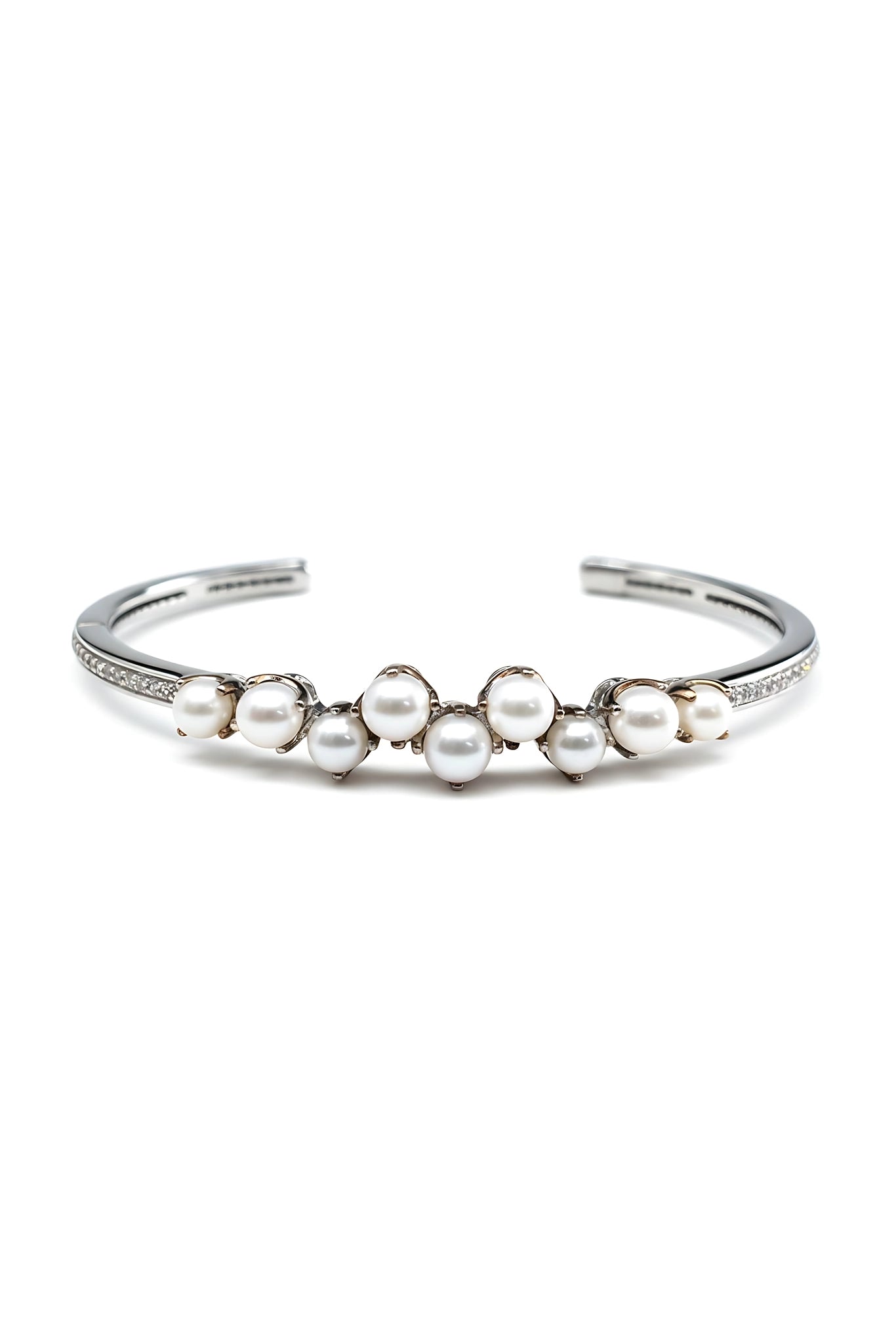Silver bracelet with pearls on a white background