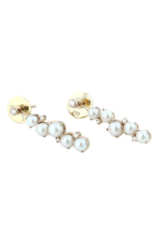 Gold and pearl earring on a white background