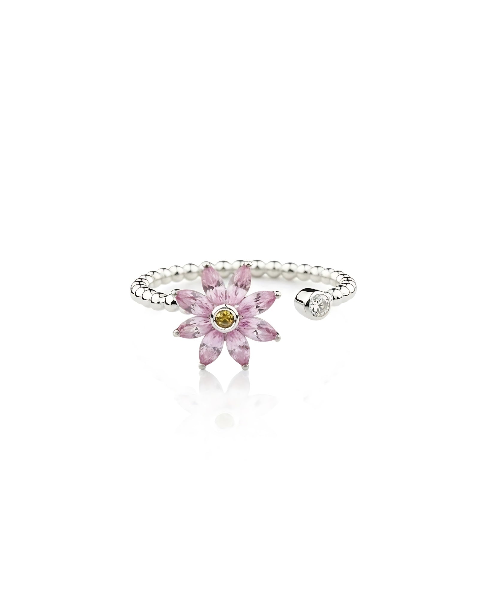 Silver ring with a pink flower-shaped gemstone on a white background