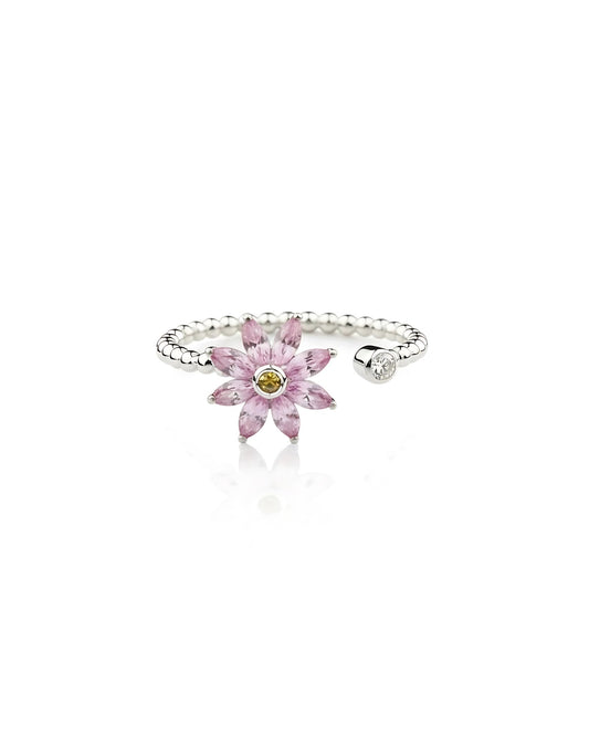 Silver ring with a pink flower-shaped gemstone on a white background